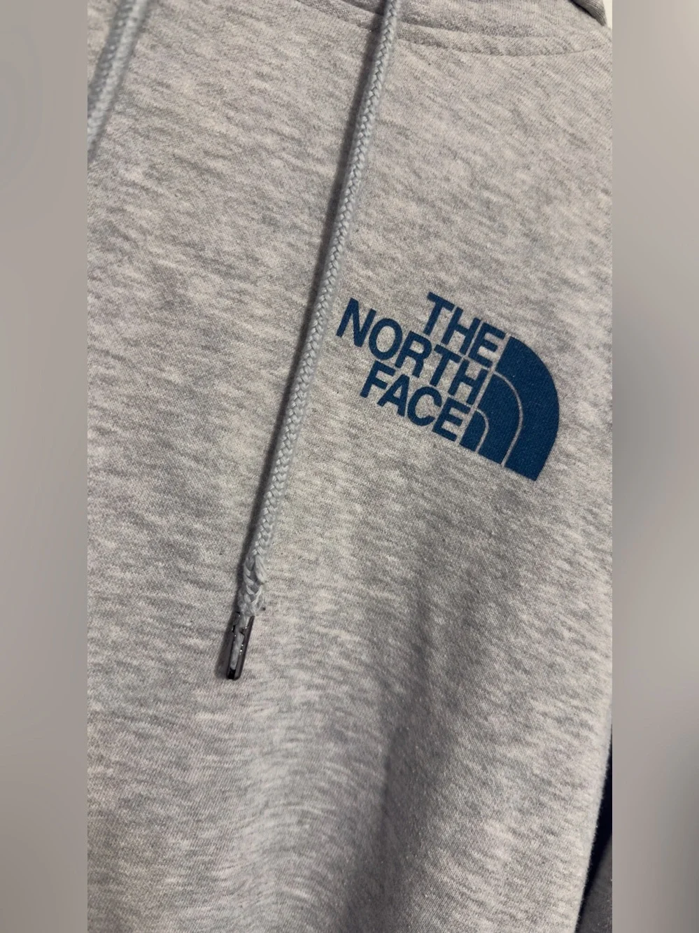 The North Face Men’s Heather Gray Pullover Hoodie with Navy Logo